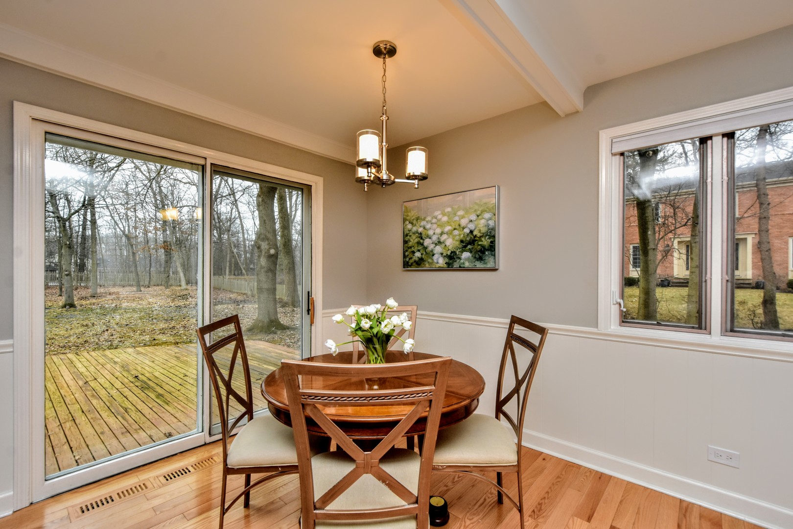 793 Cherokee Road Lake Forest, IL 60045 - Photo 4 of 39 a dining room with furniture a chandelier and wooden floor