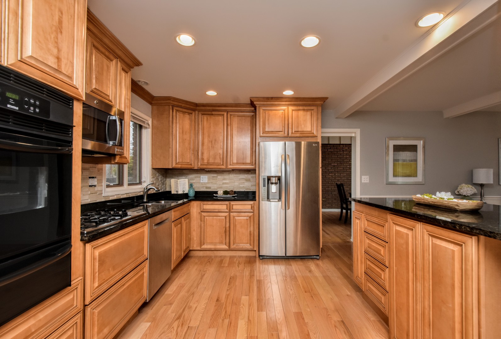 793 Cherokee Road Lake Forest, IL 60045 - Photo 7 of 39 a kitchen with granite countertop stainless steel appliances and wooden cabinets