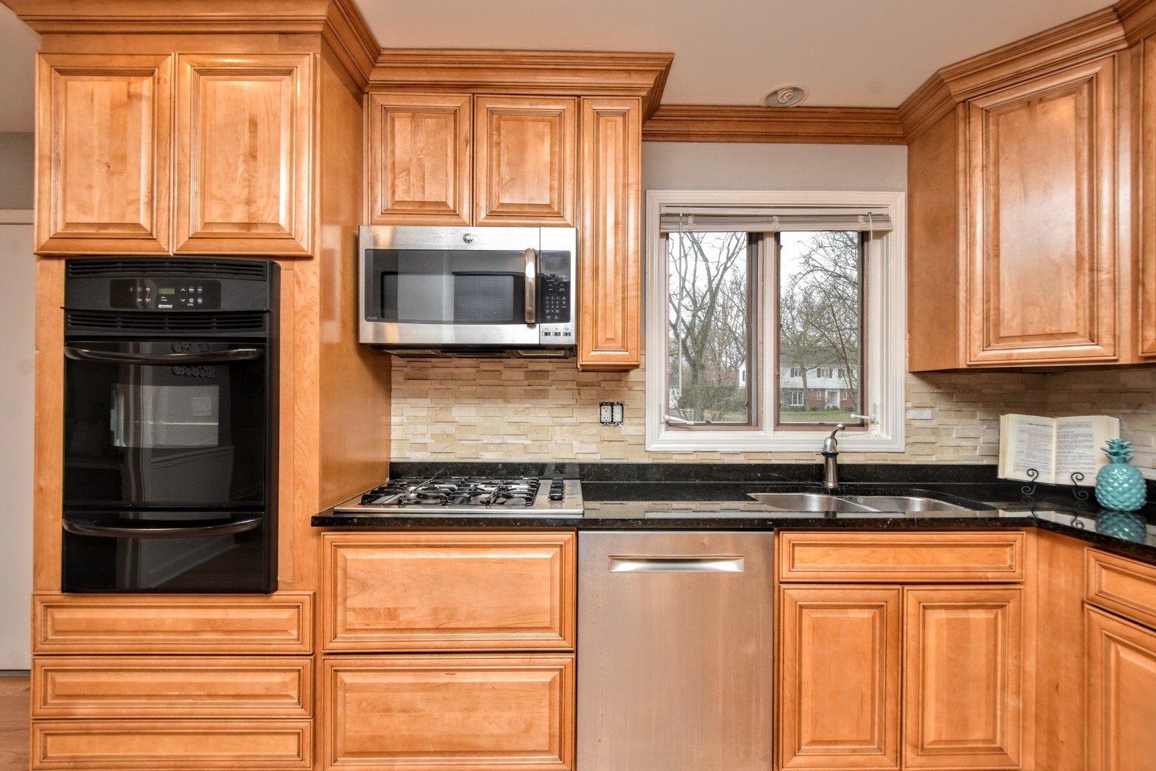 793 Cherokee Road Lake Forest, IL 60045 - Photo 10 of 39 a kitchen with granite countertop cabinets stainless steel appliances and a window