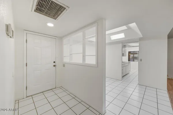 a view of an empty room and window