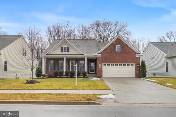 a view of a white house with a swimming pool