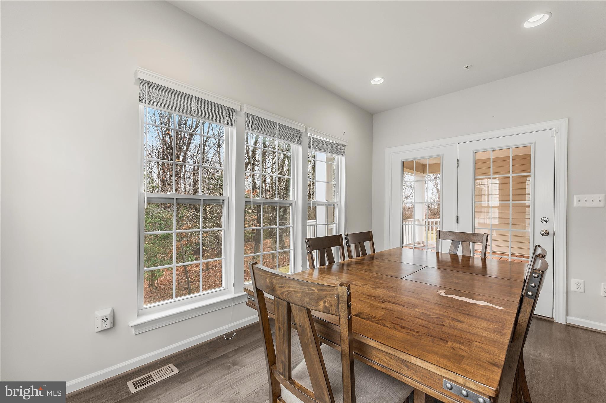 12706 Broughton Bluff Brandywine, MD 20613 - Photo 12 of 35 a dining room with furniture window and wooden floor