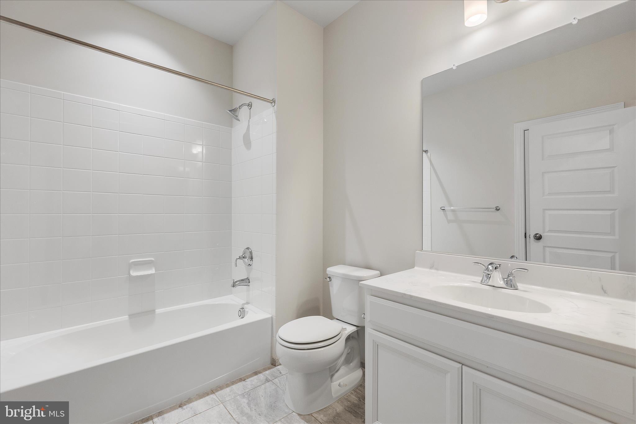 12706 Broughton Bluff Brandywine, MD 20613 - Photo 16 of 35 a bathroom with a sink a toilet and a bathtub