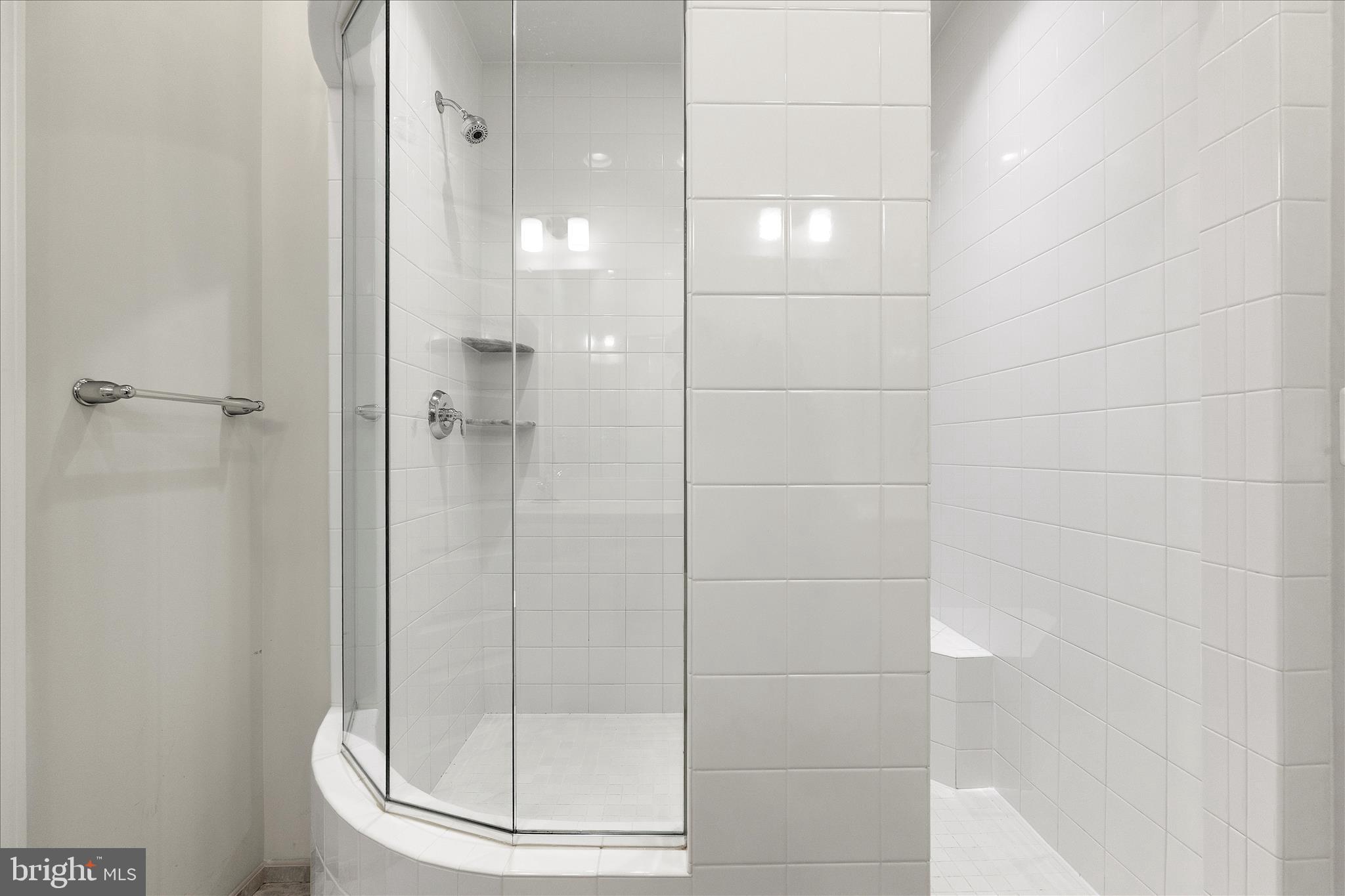 12706 Broughton Bluff Brandywine, MD 20613 - Photo 24 of 35 a bathroom with a glass shower door