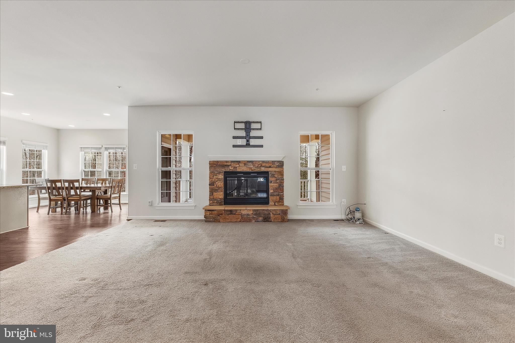 12706 Broughton Bluff Brandywine, MD 20613 - Photo 5 of 35 an empty room with furniture and a fireplace