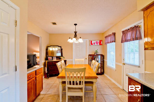 Pantry for food storage in kitchen, additional counter space.