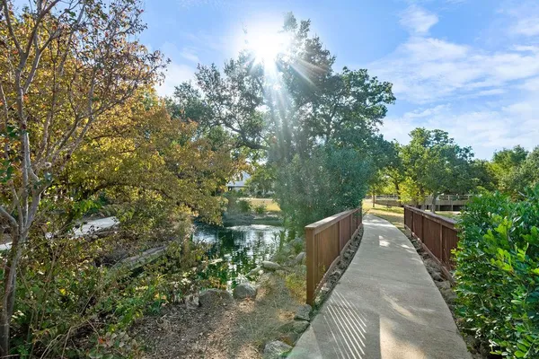 a view of swimming pool with trees