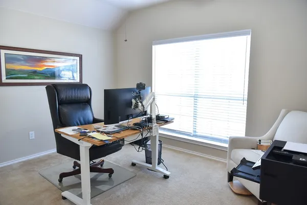 a work room with furniture and windows