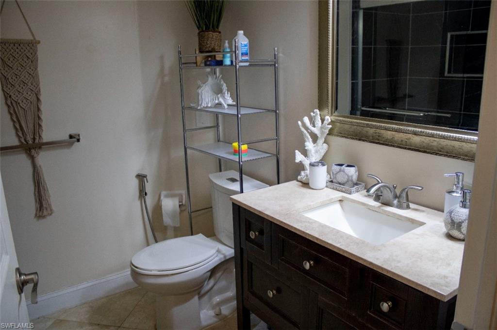 17565 Butler Road Fort Myers, FL 33967 - Photo 11 of 12 a bathroom with a sink vanity and toilet