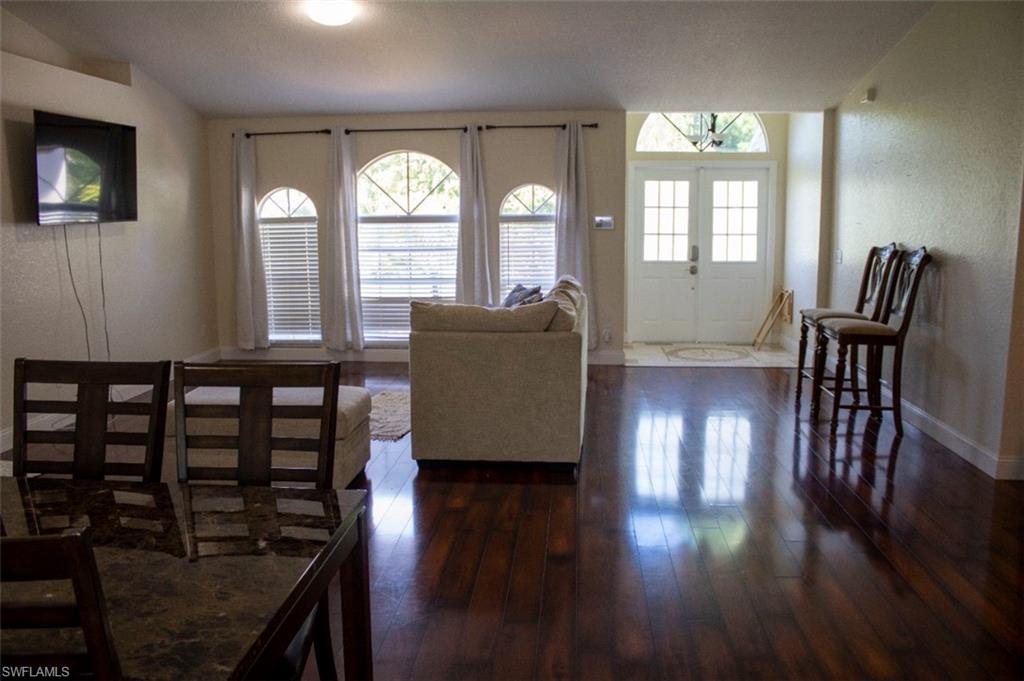 17565 Butler Road Fort Myers, FL 33967 - Photo 12 of 12 a living room with furniture and wooden floor