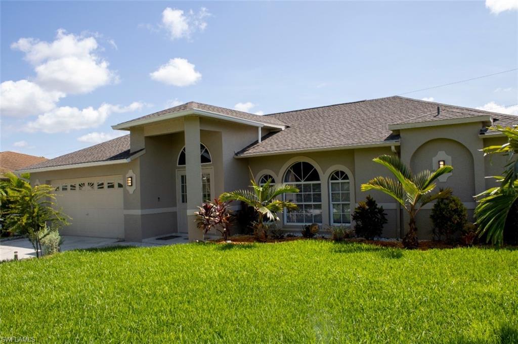 17565 Butler Road Fort Myers, FL 33967 - Photo 2 of 12 a front view of a house with garden