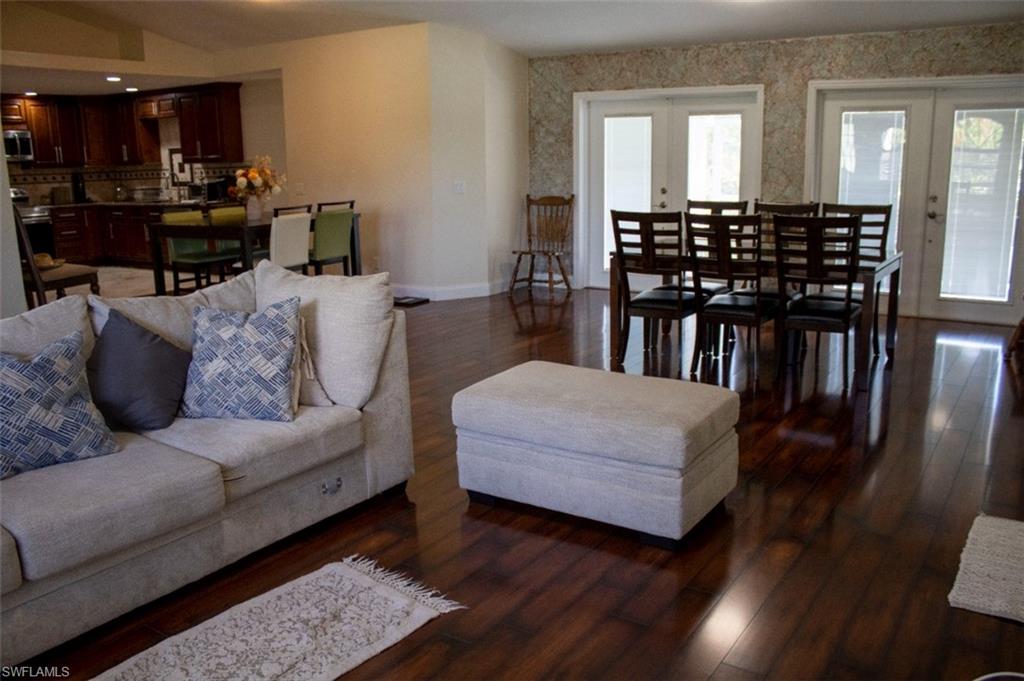 17565 Butler Road Fort Myers, FL 33967 - Photo 7 of 12 a living room with furniture and wooden floor