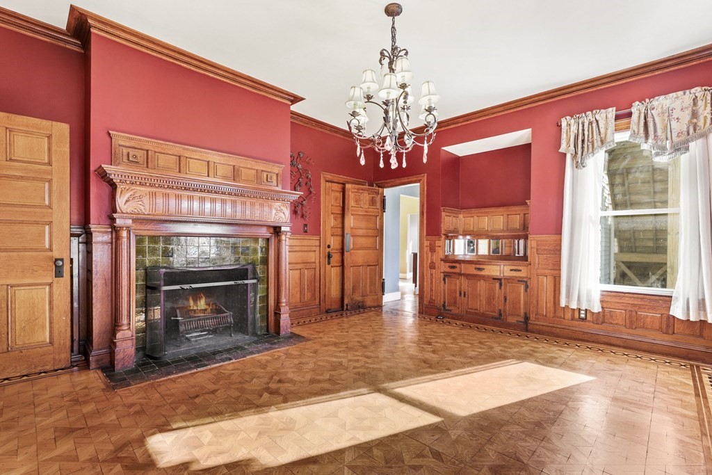 175 High Street Taunton, MA 02780 - Photo 11 of 39 a living room with furniture and a fireplace