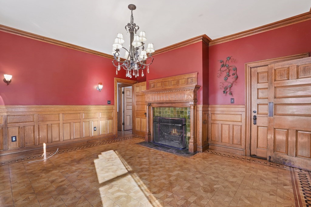 175 High Street Taunton, MA 02780 - Photo 12 of 39 a view of a livingroom with a fireplace and chandelier