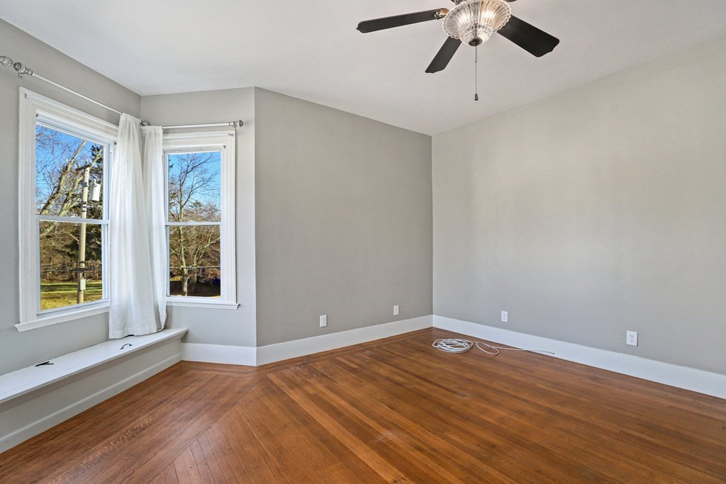 175 High Street Taunton, MA 02780 - Photo 15 of 39 a view of empty room with wooden floor and fan