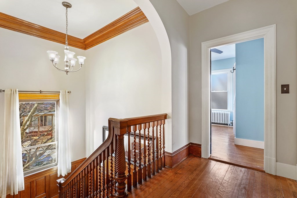 175 High Street Taunton, MA 02780 - Photo 17 of 39 a view of a hallway with wooden floor and stairs
