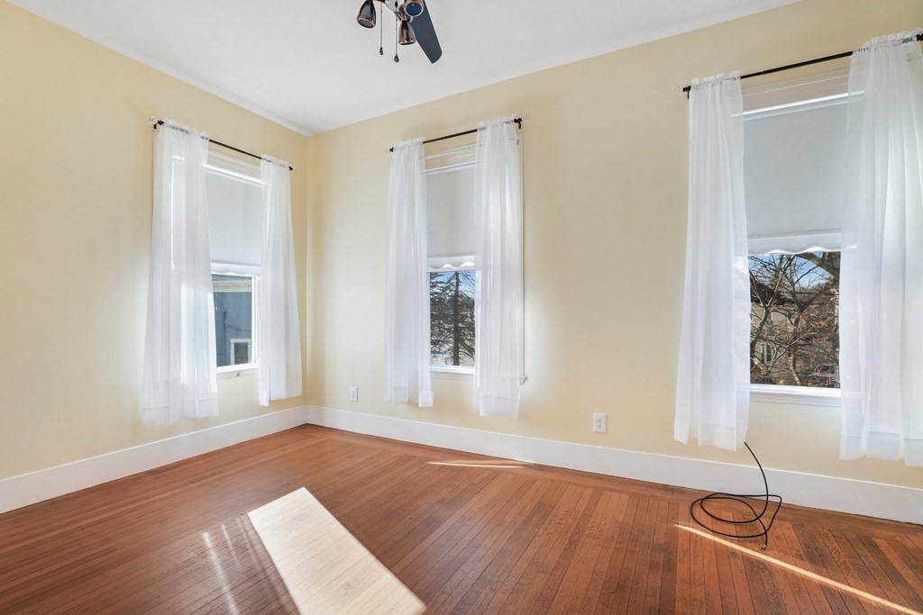 175 High Street Taunton, MA 02780 - Photo 20 of 39 a view of a livingroom with wooden floor and a window