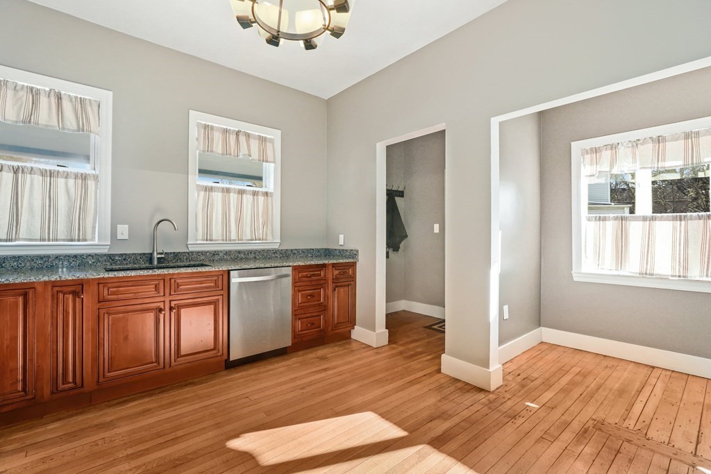 175 High Street Taunton, MA 02780 - Photo 2 of 39 a kitchen with stainless steel appliances granite countertop a sink a stove cabinets and wooden floor