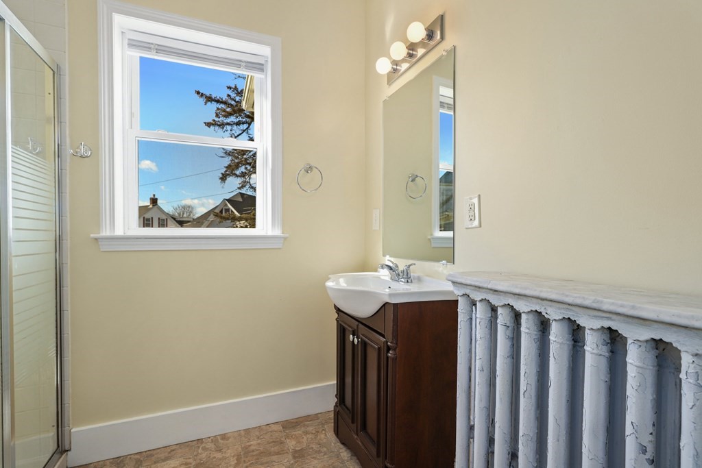 175 High Street Taunton, MA 02780 - Photo 22 of 39 a bathroom with a sink and a mirror