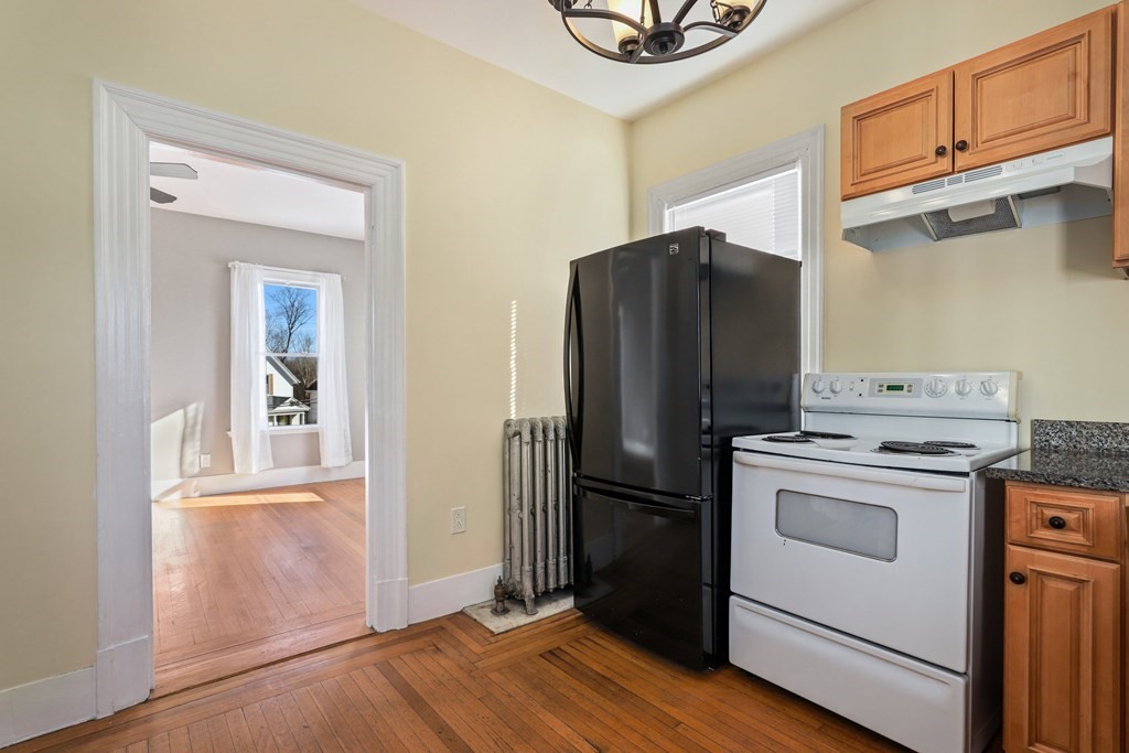 175 High Street Taunton, MA 02780 - Photo 24 of 39 a kitchen with a refrigerator and a stove