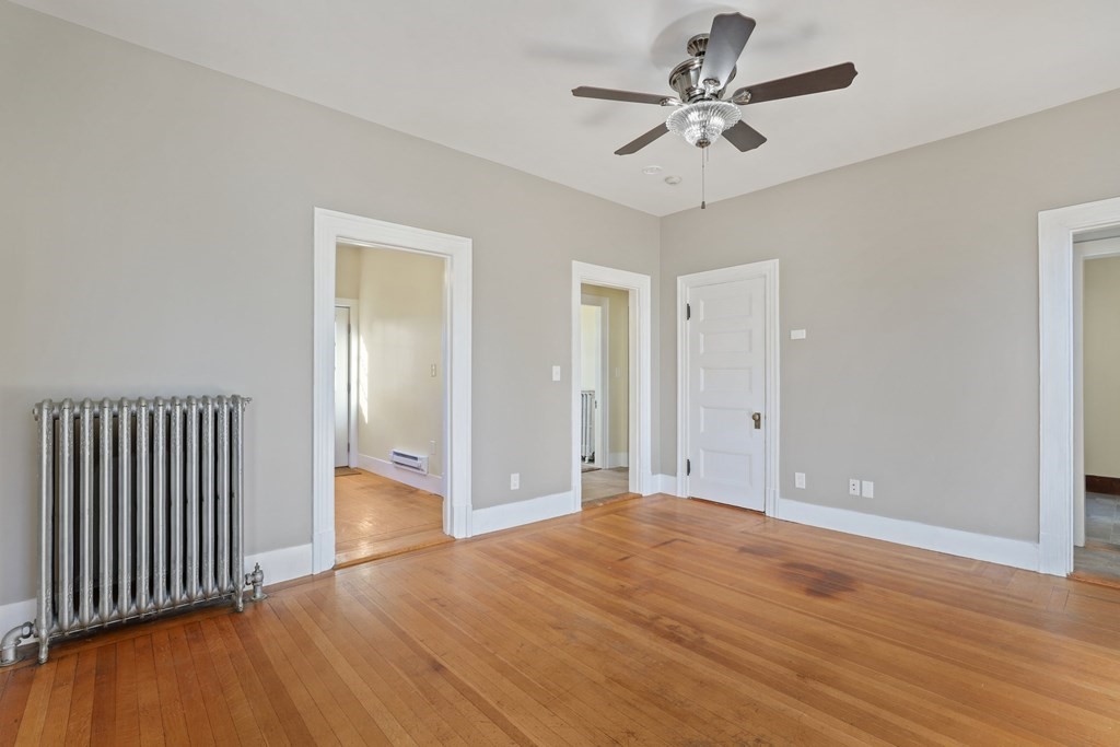 175 High Street Taunton, MA 02780 - Photo 27 of 39 a view of a room with a ceiling fan window and wooden floor