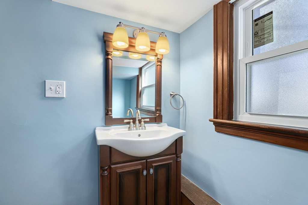 175 High Street Taunton, MA 02780 - Photo 30 of 39 a bathroom with a sink and a mirror