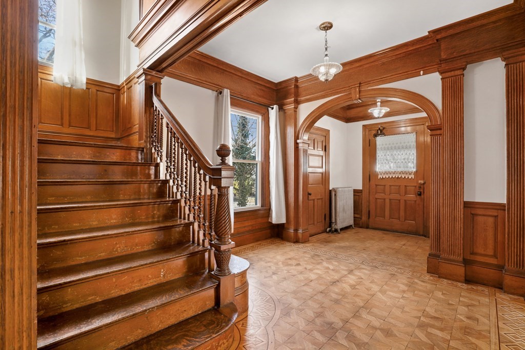 175 High Street Taunton, MA 02780 - Photo 9 of 39 a view of entryway and hall with wooden floor