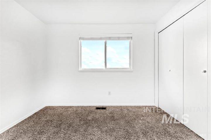 2481 West Rebecca Way Meridian, ID 83646 - Photo 13 of 17 Unfurnished bedroom featuring carpet and a closet