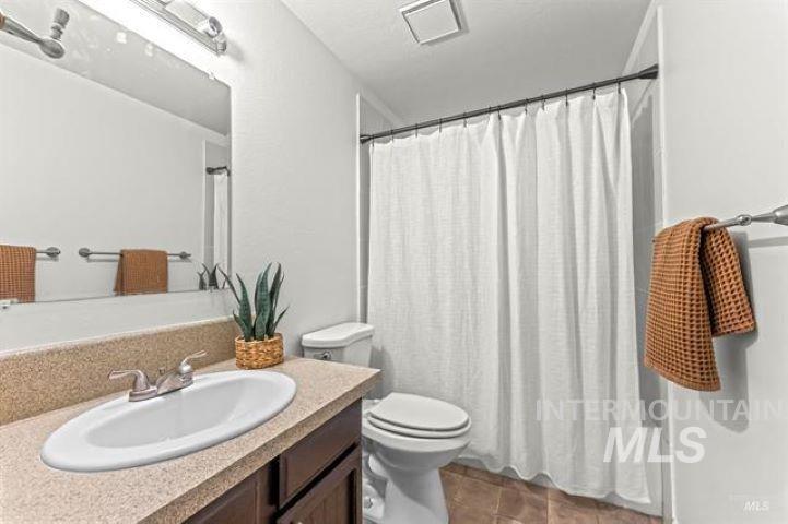 2481 West Rebecca Way Meridian, ID 83646 - Photo 14 of 17 Full bathroom featuring vanity and toilet