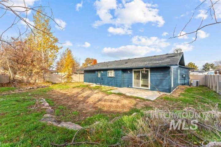 2481 West Rebecca Way Meridian, ID 83646 - Photo 16 of 17 Rear view of property with a fenced backyard and a patio area