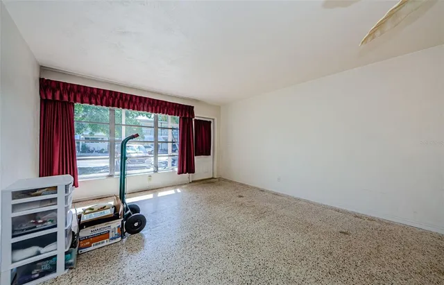 a view of an empty room with a window