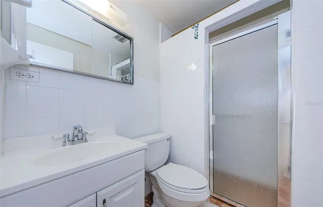 a kitchen with cabinets appliances and a sink