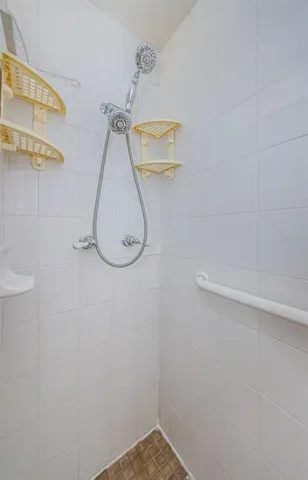 a kitchen with white cabinets and appliances