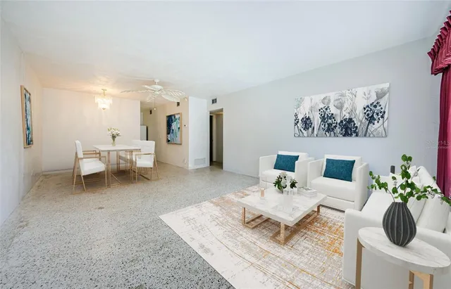 a living room with furniture and white walls