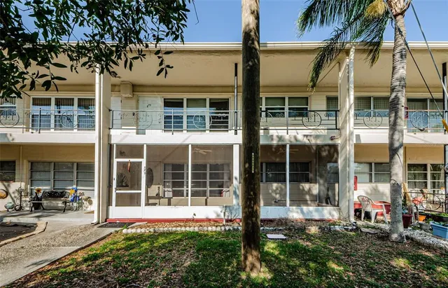 front view of a building with a garden