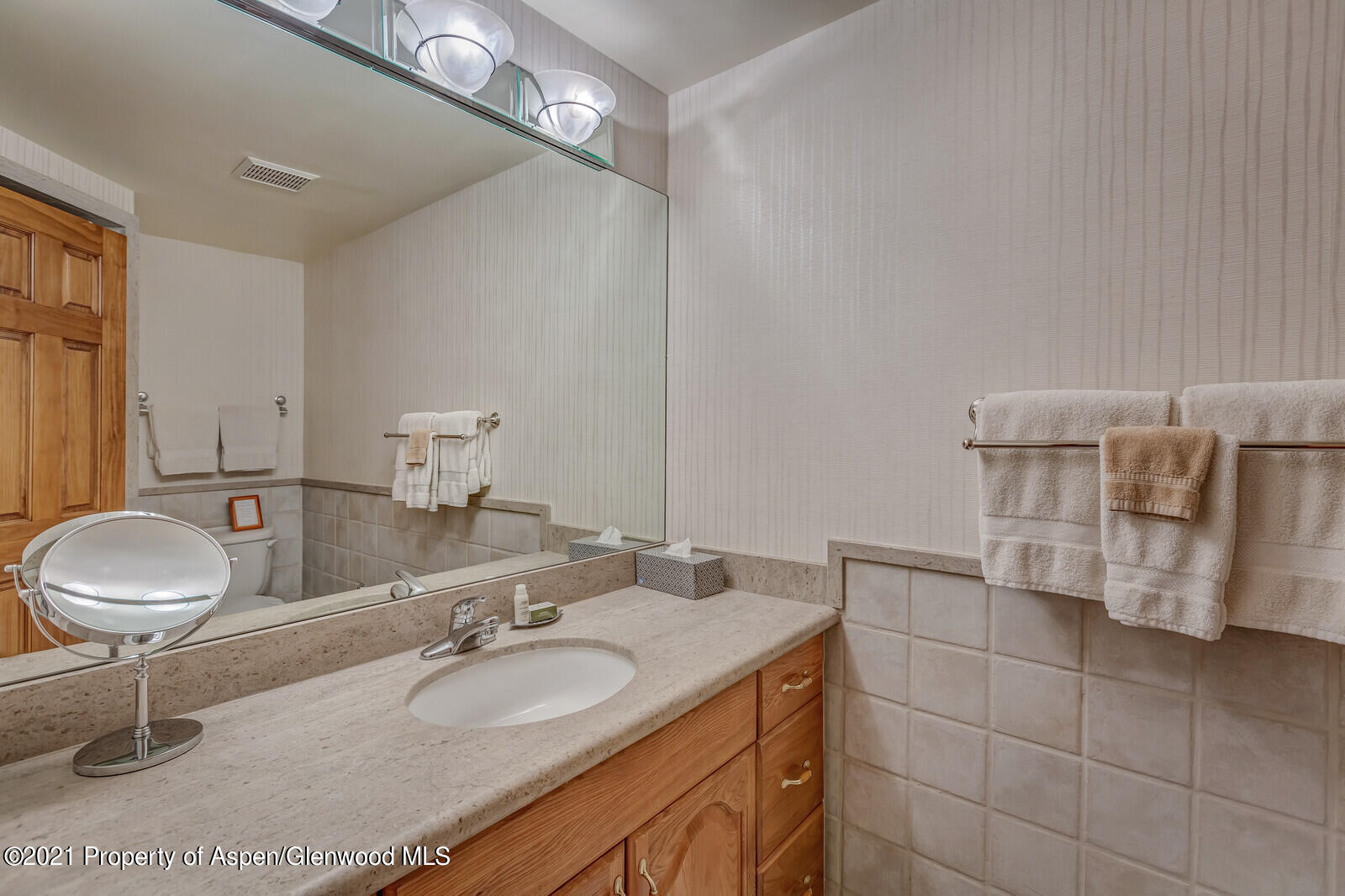 650 South Monarch Street, Unit 6 Aspen, CO 81611 - Photo 11 of 28 a bathroom with a granite countertop sink and a mirror
