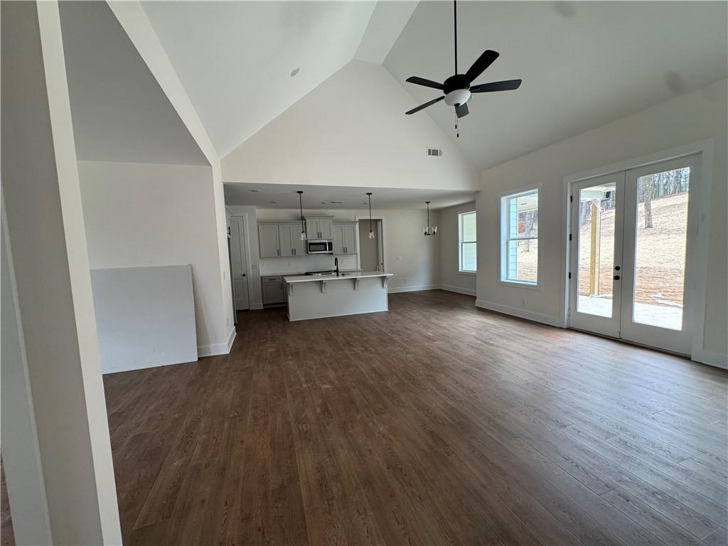 1699 Darby Road Waleska, GA 30183 - Photo 3 of 17 wooden floor in an empty room with a window