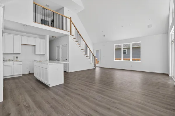 a view of kitchen with furniture and wooden floor