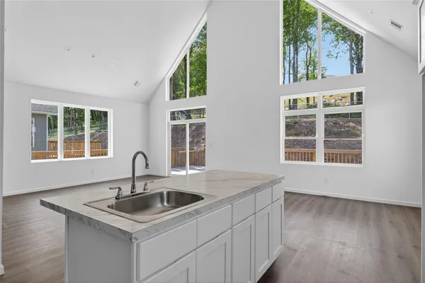 a kitchen with a sink and a window
