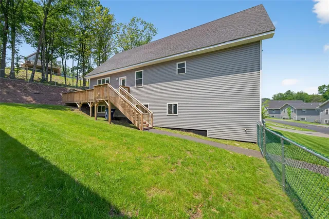 a front view of house with yard and seating area