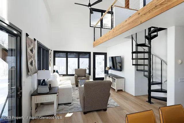 a living room with furniture fireplace and flat screen tv