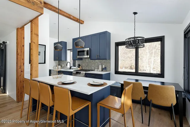 a view of a dining room with furniture and window