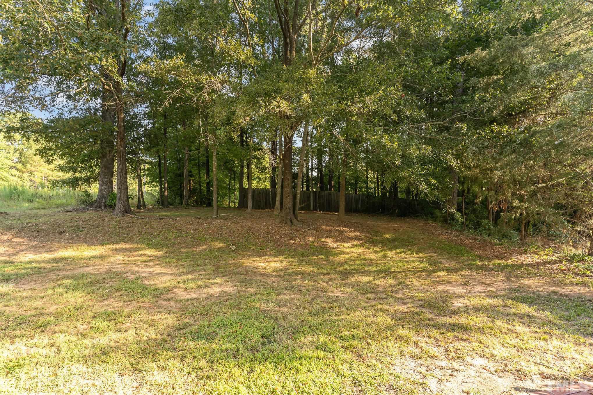 2014 Talloway Drive Cary, NC 27511 - Photo 13 of 18 a view of a yard with a trees