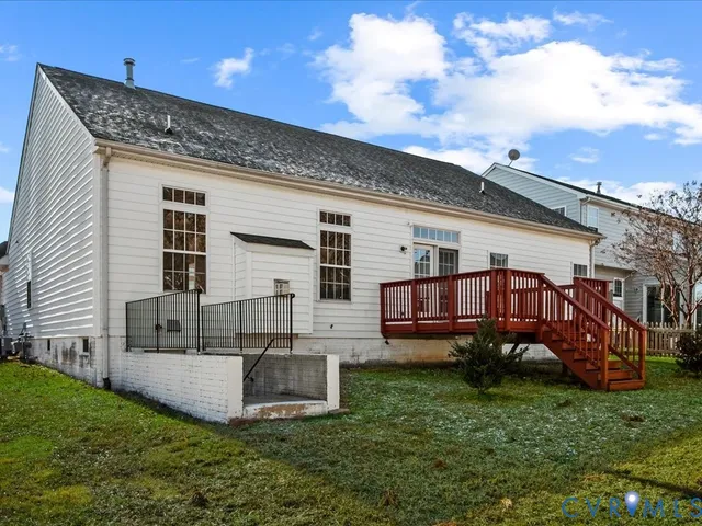 a view of a house with a yard and sitting area