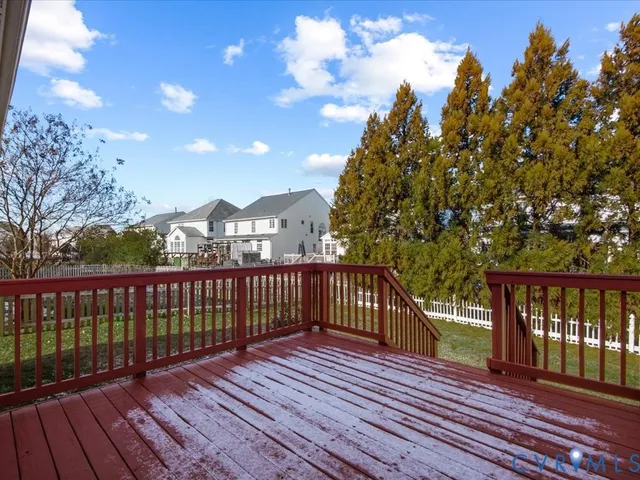 a view of a balcony with wooden floor