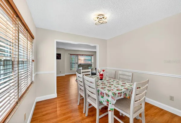 a view of a dining room with furniture and wooden floor