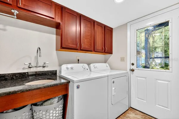 a utility room with dryer and washer