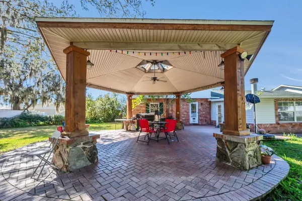 a view of a swimming pool with sitting area
