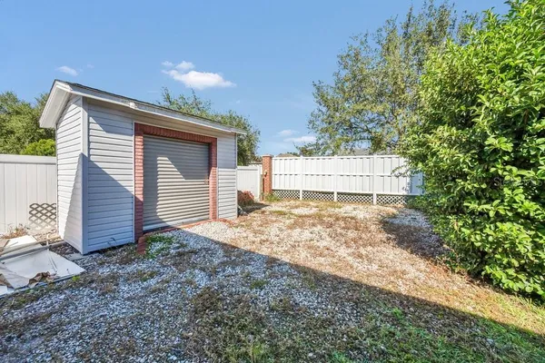 a view of a house with a yard and garage