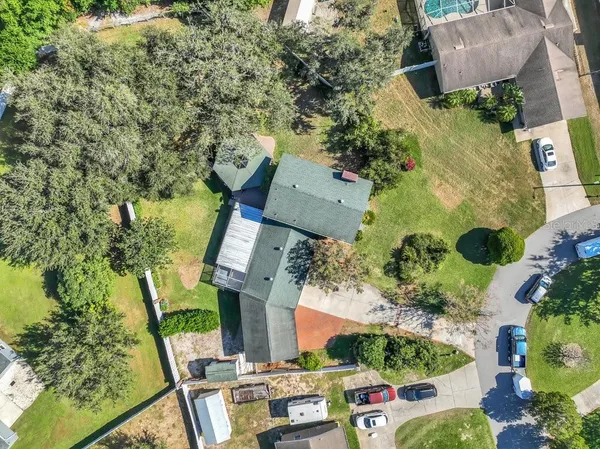 an aerial view of house with yard swimming pool and outdoor seating